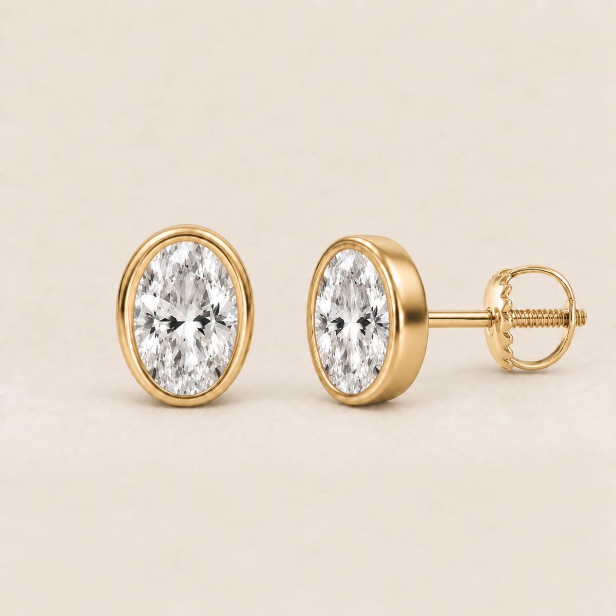 Oval lab-grown diamond stud earrings, 14K yellow gold, 1.5 CT total weight per pair, bezel setting with screw backs